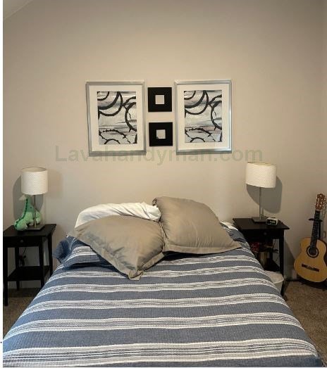 hanging artwork on drywall, concrete, and brick walls