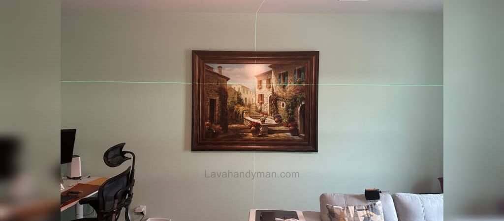 A Comprehensive Article on Laser Levels and Their Application in Installing Artwork on Walls