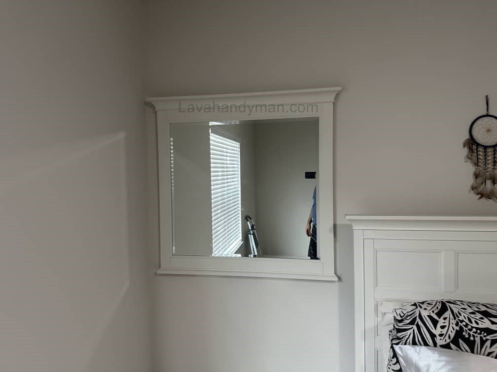 Installing a Mirror on the Wall with a Laser Level